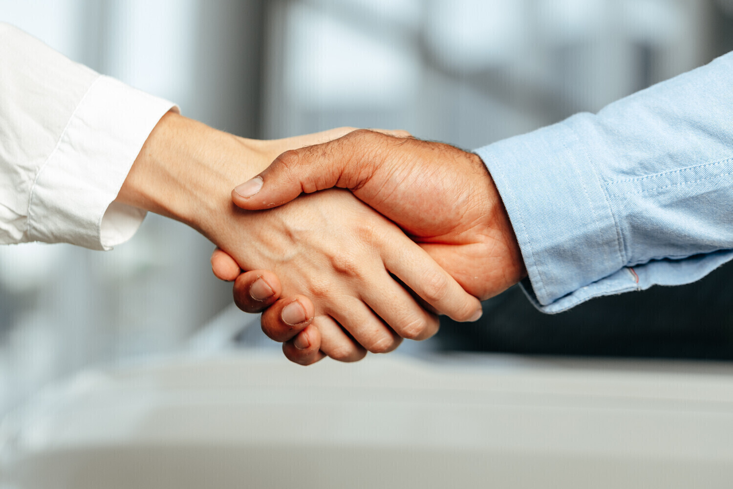Close up of a handshake between two people