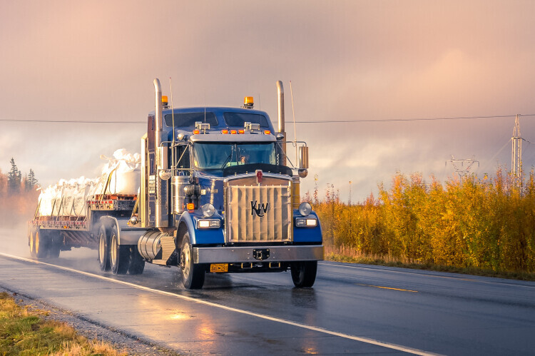 Large truck driving on road